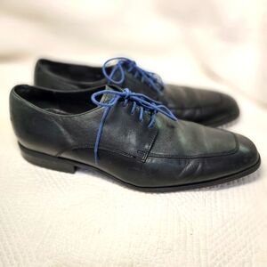 Cole Haan black leather oxfords.